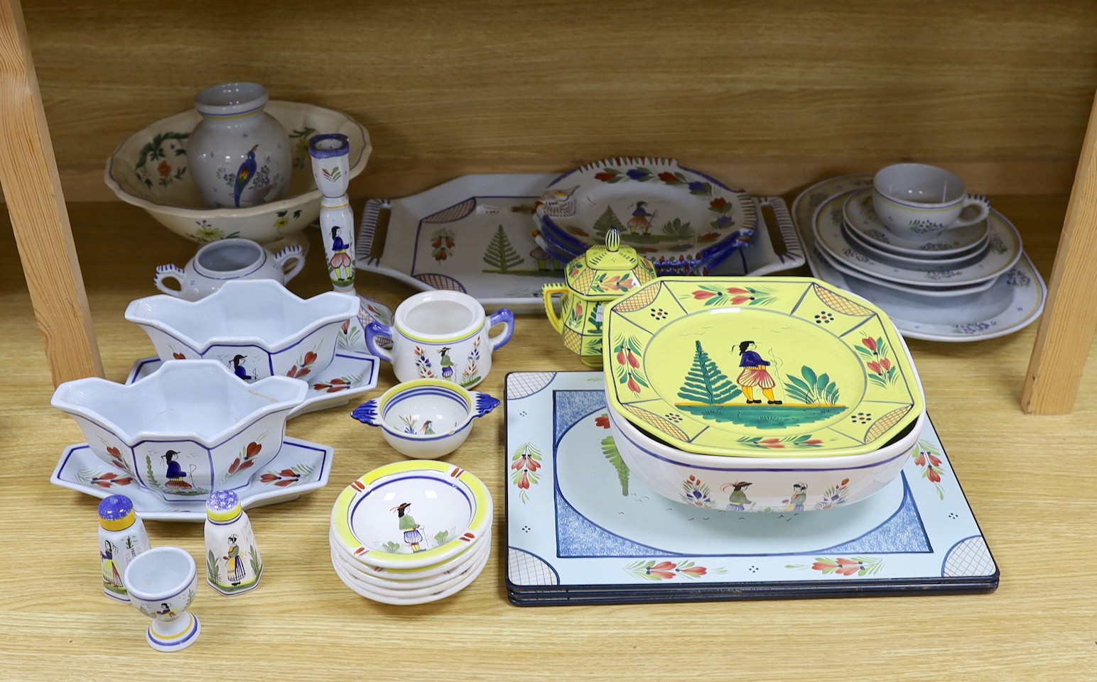 A collection of French Quimper tablewares